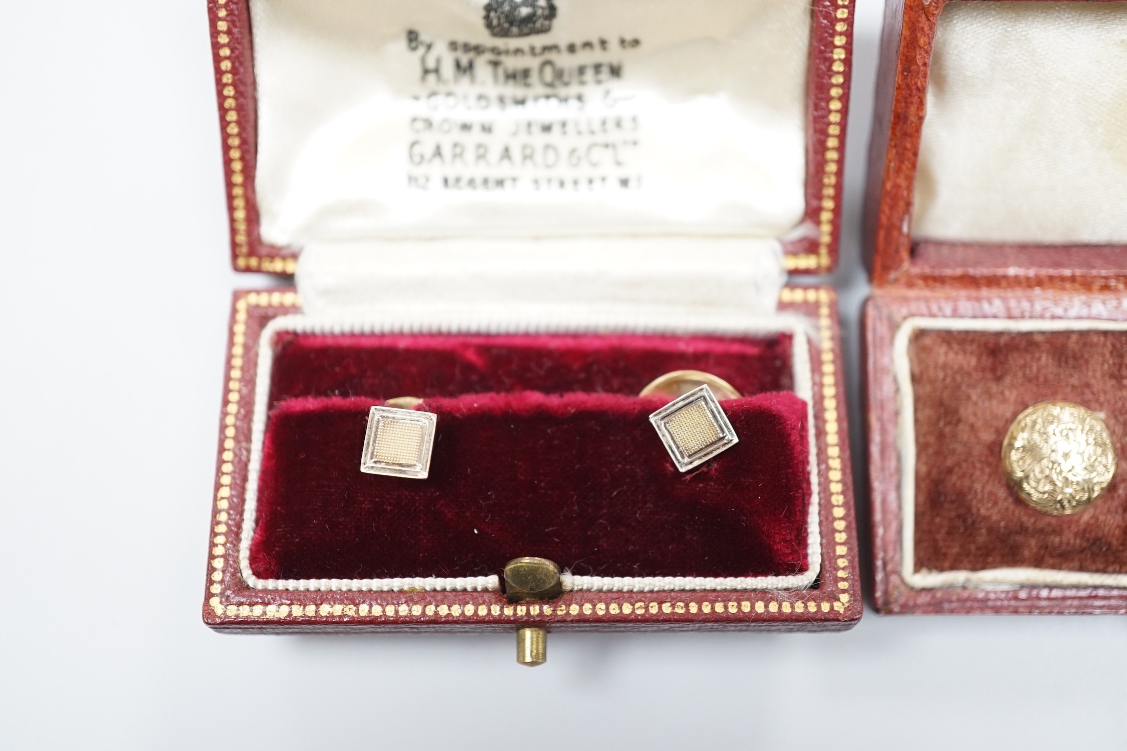 A modern cased pair of 9ct gold dress studs and a cased set of three yellow metal dress studs, gross 4 grams.